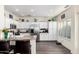 Bright eat-in kitchen featuring white cabinets, stainless steel appliances, and granite countertops at 4038 E Wagon Cir, Gilbert, AZ 85297