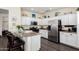Bright kitchen featuring white cabinets, stainless steel appliances, and granite countertops at 4038 E Wagon Cir, Gilbert, AZ 85297