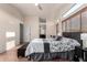 Spacious main bedroom featuring a vaulted ceiling, ceiling fan, and access to a bathroom at 4038 E Wagon Cir, Gilbert, AZ 85297