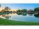 Community pond reflects the surrounding landscape at sunset, offering a serene setting at 4038 E Wagon Cir, Gilbert, AZ 85297