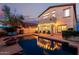 Inviting backyard with a pool and an outdoor seating area perfect for entertaining at 4038 E Wagon Cir, Gilbert, AZ 85297