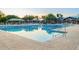 Resort-style pool offers a refreshing escape with ample deck space and shaded seating areas at 4038 E Wagon Cir, Gilbert, AZ 85297