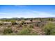 Expansive aerial view of the property showcasing the desert landscape and community amenities at 41627 N Cedar Chase Rd, Anthem, AZ 85086
