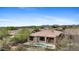 Aerial view of home with backyard pool and spa in desert neighborhood with desert landscaping at 41627 N Cedar Chase Rd, Anthem, AZ 85086