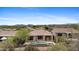Aerial view of the backyard pool and deck of single Gathering home in desert community at 41627 N Cedar Chase Rd, Anthem, AZ 85086