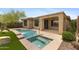 A relaxing backyard with pool, spa, and covered patio at 41627 N Cedar Chase Rd, Anthem, AZ 85086