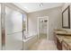 Serene bathroom with glass-enclosed shower, separate tub, and dual sink vanity at 41627 N Cedar Chase Rd, Anthem, AZ 85086