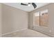 Bedroom with neutral walls, tiled flooring, and a window at 41627 N Cedar Chase Rd, Anthem, AZ 85086