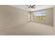Spacious bedroom with ample natural light, carpeted floors, and a walk-out balcony at 41627 N Cedar Chase Rd, Anthem, AZ 85086