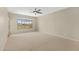 This bedroom features a ceiling fan and carpeted floor at 41627 N Cedar Chase Rd, Anthem, AZ 85086