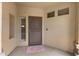 Front entryway with a security door and a small window at 41627 N Cedar Chase Rd, Anthem, AZ 85086