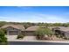 Three-car garage home with desert landscaping, paver driveway and sidewalks at 41627 N Cedar Chase Rd, Anthem, AZ 85086