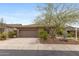 Single-Gathering home with desert landscaping and three-car garage in a residential neighborhood at 41627 N Cedar Chase Rd, Anthem, AZ 85086