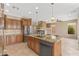 Gourmet kitchen featuring a large island, stainless steel appliances, and custom cabinets at 41627 N Cedar Chase Rd, Anthem, AZ 85086