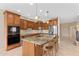 Spacious kitchen with custom cabinetry, granite countertops, and stainless steel appliances at 41627 N Cedar Chase Rd, Anthem, AZ 85086