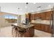 Gourmet kitchen featuring granite counters, central island, and modern appliances at 41627 N Cedar Chase Rd, Anthem, AZ 85086