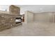 Open-concept living area boasting a stone fireplace at 41627 N Cedar Chase Rd, Anthem, AZ 85086