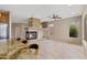 Spacious living room featuring stone fireplace at 41627 N Cedar Chase Rd, Anthem, AZ 85086