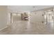 Spacious living room featuring a stone fireplace and neutral tile flooring at 41627 N Cedar Chase Rd, Anthem, AZ 85086