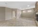 Living room with a stone fireplace and access to multiple rooms at 41627 N Cedar Chase Rd, Anthem, AZ 85086
