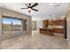 Open-concept living area with a kitchen and a beautiful view of the pool and patio at 41627 N Cedar Chase Rd, Anthem, AZ 85086