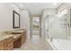 Bathroom features double vanity, tub, and walk-in shower at 41627 N Cedar Chase Rd, Anthem, AZ 85086