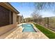Backyard featuring a private pool, desert landscape, and privacy fence at 41627 N Cedar Chase Rd, Anthem, AZ 85086