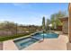 Beautiful backyard pool and spa with mature landscaping, privacy wall and desert views at 41627 N Cedar Chase Rd, Anthem, AZ 85086