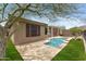Inviting backyard pool with desert landscaping offers a private oasis for relaxation and outdoor enjoyment at 41627 N Cedar Chase Rd, Anthem, AZ 85086