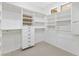 Organized walk-in closet with custom shelving, drawers, and ample storage space at 41627 N Cedar Chase Rd, Anthem, AZ 85086