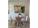 Cozy dining area with a glass table, comfortable seating, and modern lighting, perfect for meals at 4540 N 35Th N Ave, Phoenix, AZ 85017