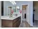 Bathroom featuring double sink vanity, ample storage, and a step-in shower at 4605 W Fawn Dr, Laveen, AZ 85339