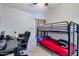 Spacious bedroom with a bunk bed and a desk, offering a functional and stylish space at 4605 W Fawn Dr, Laveen, AZ 85339