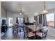 Open-concept dining room featuring table with seating for six and large windows at 4605 W Fawn Dr, Laveen, AZ 85339