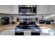 Close up image showcasing stainless steel oven and microwave oven with white cabinetry at 4605 W Fawn Dr, Laveen, AZ 85339