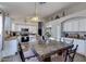 Inviting kitchen with stainless appliances, breakfast bar and adjacent dining space at 4605 W Fawn Dr, Laveen, AZ 85339