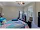 Bright main bedroom features a ceiling fan, soft carpet, and an ensuite bathroom at 4605 W Fawn Dr, Laveen, AZ 85339