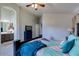 Bright main bedroom with ensuite bathroom access, ceiling fan and neutral paint at 4605 W Fawn Dr, Laveen, AZ 85339