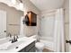 A cozy bathroom featuring a shower-tub combo, single sink vanity, and neutral color palette at 5135 E Evergreen St # 1159, Mesa, AZ 85205