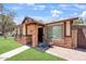 Home exterior showcasing brick accents, a well-maintained lawn, and a front entryway at 5135 E Evergreen St # 1159, Mesa, AZ 85205
