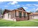 A charming single-story home features manicured lawn and brick accents at 5135 E Evergreen St # 1159, Mesa, AZ 85205