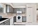 Well-lit kitchen features gray cabinets, white appliances, and generous counter space for cooking at 5135 E Evergreen St # 1159, Mesa, AZ 85205