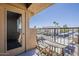 Balcony view featuring a table, chairs and fenced railing at 5302 E Van Buren St # 3040, Phoenix, AZ 85008