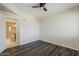 Bedroom featuring wood floors, light walls, and a view into an updated bathroom through a doorway at 5302 E Van Buren St # 3040, Phoenix, AZ 85008