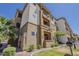 Inviting multi-story condo featuring stucco siding, landscaping, balconies, and a barbecue grill at 5302 E Van Buren St # 3040, Phoenix, AZ 85008