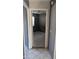 Cozy hallway leading to a tiled-floor bedroom, providing seamless transition and a glimpse of comfort at 537 E Piute Ave, Phoenix, AZ 85024