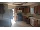 Kitchen with ample counter space, wood cabinets, and standard appliances, ready for culinary adventures at 537 E Piute Ave, Phoenix, AZ 85024