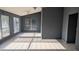Spacious living room with large windows, tiled floors, and a ceiling fan, providing ample natural light at 537 E Piute Ave, Phoenix, AZ 85024