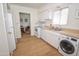 Well-equipped kitchen with modern appliances, ample counter space, and convenient in-unit laundry at 5550 N 12Th St # 15, Phoenix, AZ 85014