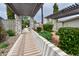 Beautifully landscaped walkway leading to the building, with lush greenery and a pergola at 5550 N 12Th St # 15, Phoenix, AZ 85014
